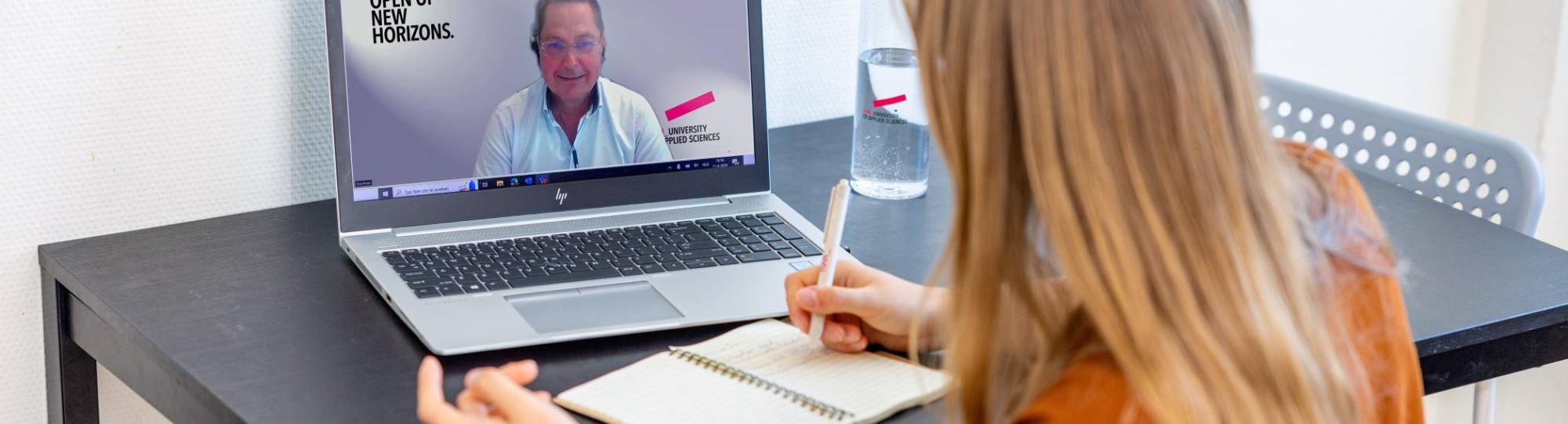 Personal 1:1 Meeting between Two People Behind Laptops about studying at HAN University of Applied Sciences