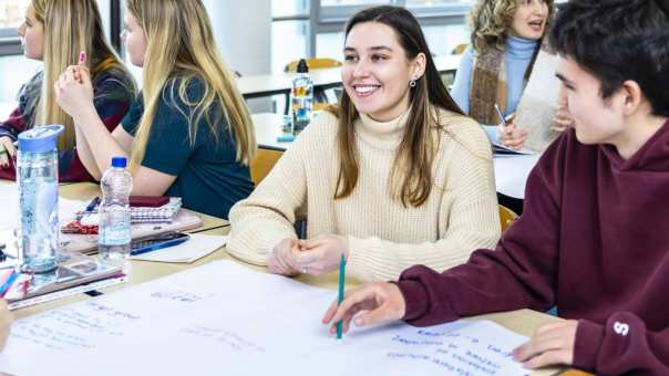 Female student laughs while present in class | Bachelor of International Social Work for international students in the Netherlands | HAN University of Applied Sciences