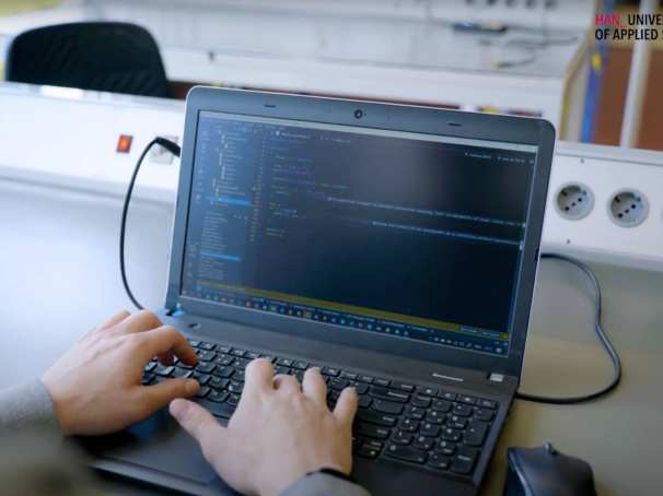 Embedded Systems Engineering student William programming on his laptop