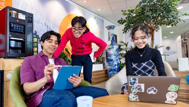 International students Diego, Patrick and Tam studying in the lounge on the Arnhem campus, building R31. 