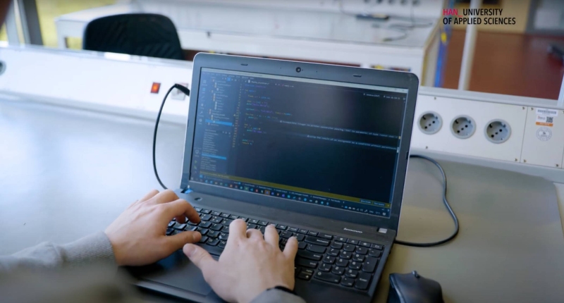 Embedded Systems Engineering student William programming on his laptop