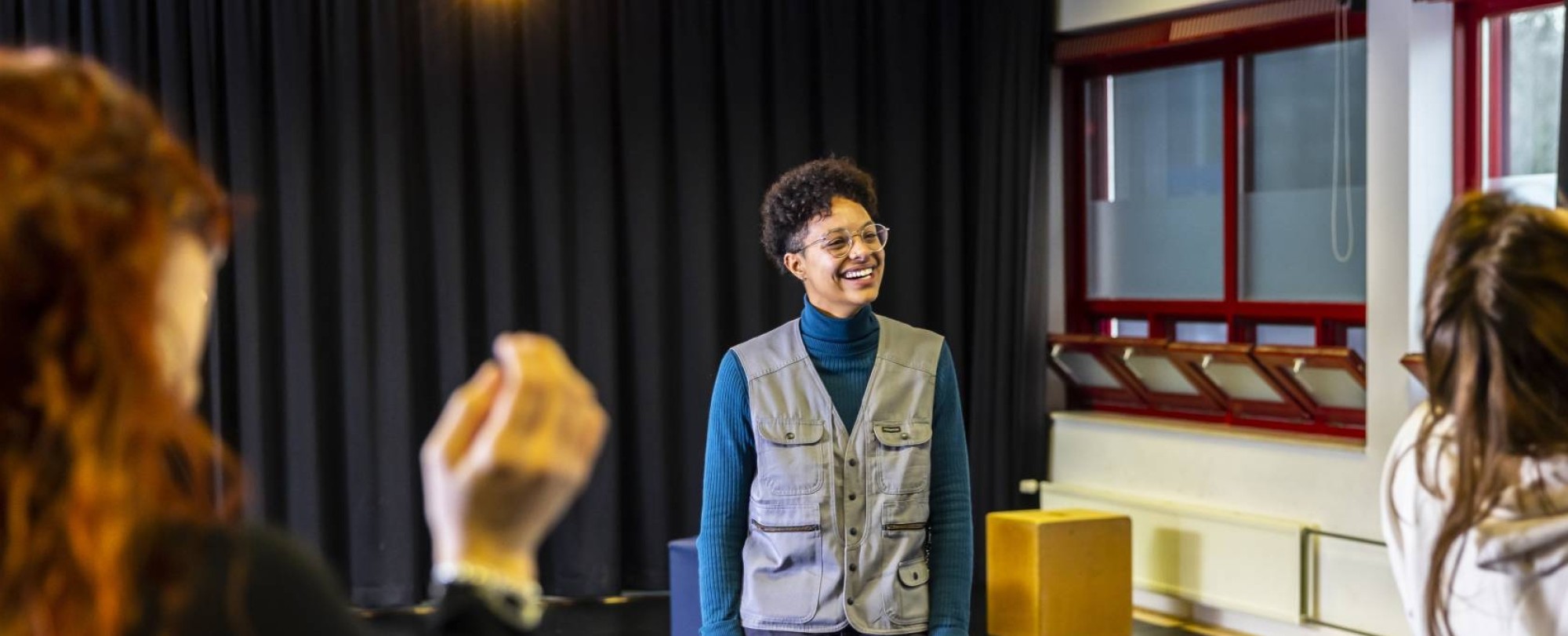 Female student laughs while present in class | Bachelor of International Social Work for international students in the Netherlands | HAN University of Applied Sciences