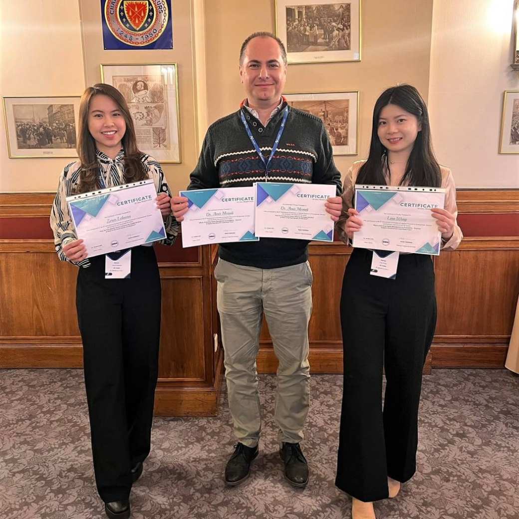 Zeren Lelaona, Lina Weng, and Dr. Amir Moradi smile and show off their co-authorship certificates