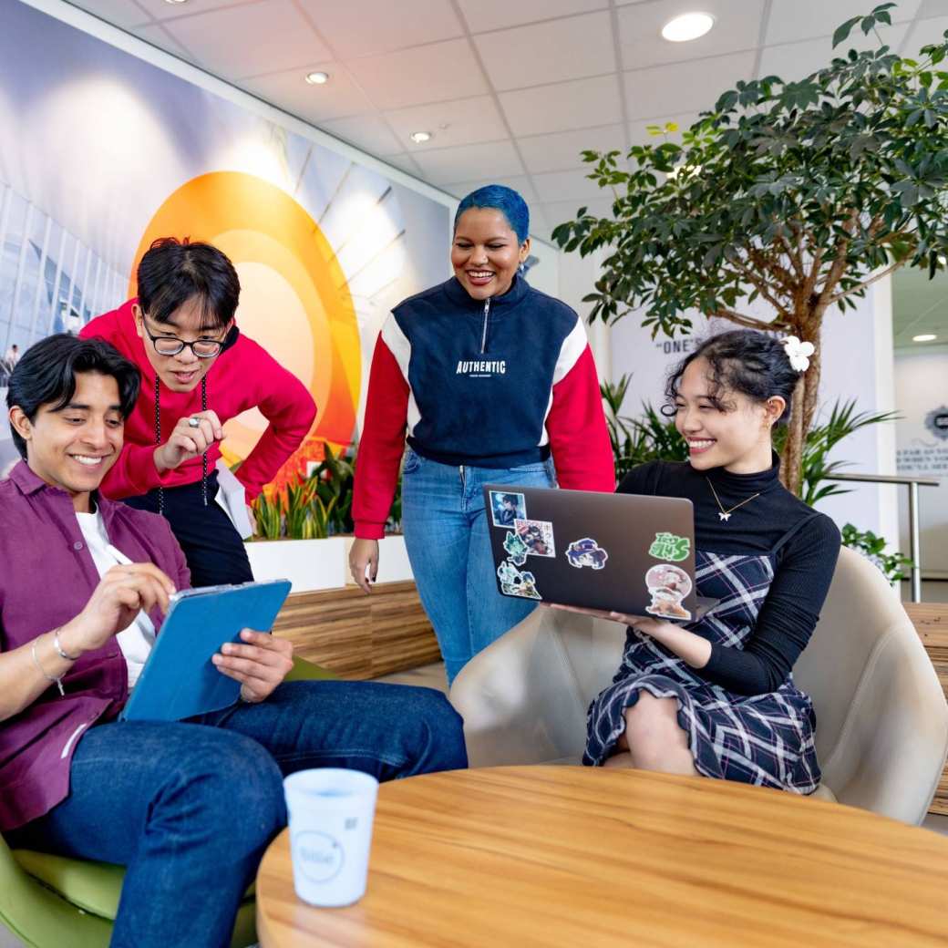 International students studying in the lounge on the Arnhem campus of HAN University of Applied Sciences. 