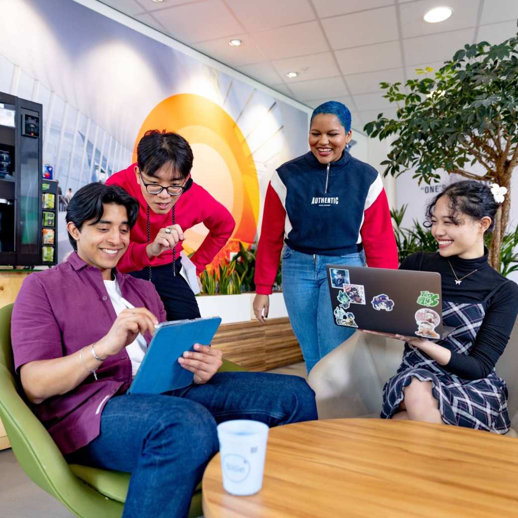 International students studying in the lounge on the Arnhem campus of HAN University of Applied Sciences. 