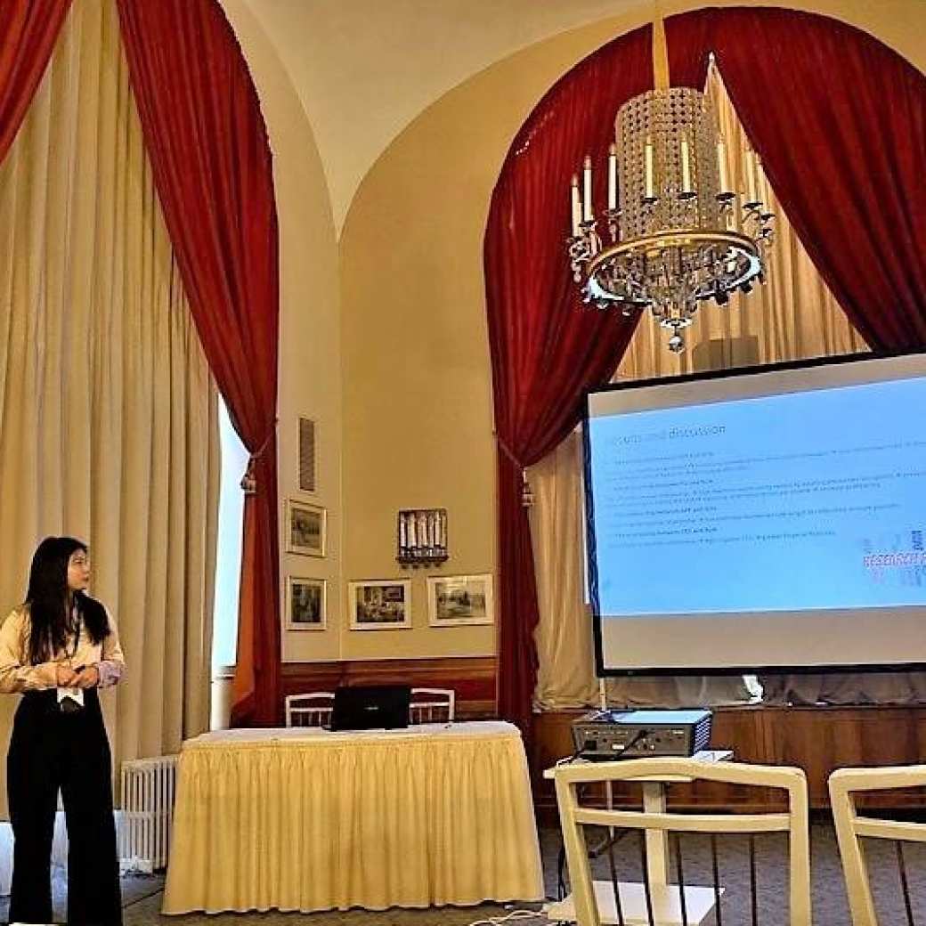 Lina Weng presents at a conference in Vienna.