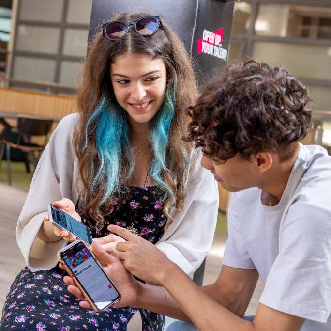 International students signing up for the Online Open Day on their phones. 